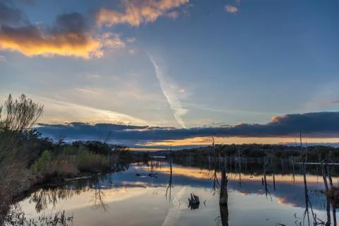 Sunset Shining Cloud Reflected On Large Lake Stock Photos