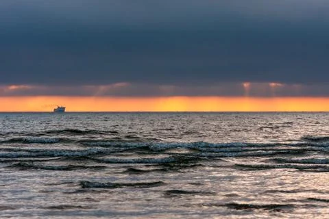 Sunset,the ship on the horizon. Stock Photos