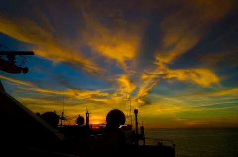 Sunset with ship radar silhoutte Stock Photos