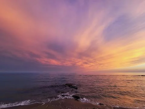 Sunset on the shore of the beach Stock Photos