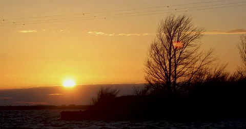 Sunset on the shore of the Danube river 4k Stock Footage 224965955