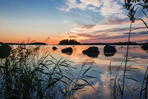 Sunset by the shore. Stock Photos