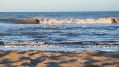 Sunset on the shore with waves breaking Stock Footage 267591334