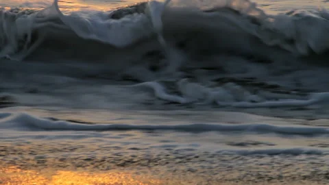 Sunset Shoreline with Foaming Ocean Waves and Golden Reflections 스톡 동영상 344163266