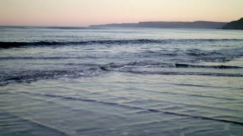 Sunset shot of sea waves on beach Video stock 167954034