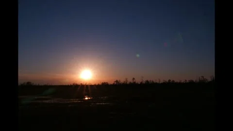 Sunset in Siberian bog. Timelapse Stock Footage 283000063