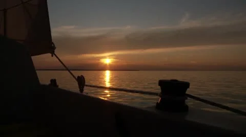 Sunset off the side of a sailboat Stock Footage 8950895