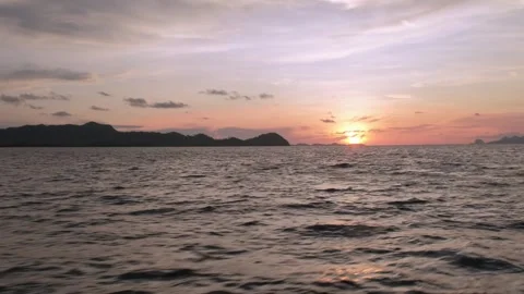 Sunset side view of a Ship Sailing in the Ocean. Stock Footage 254661108