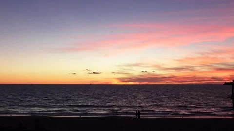 Sunset with sihouette of Couple on the beach Stock Footage 82219620