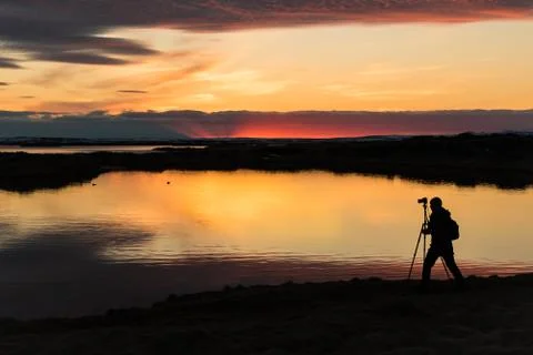 Sunset with a silhouette of a cameraman at Myvatn Iceland Stock Photos