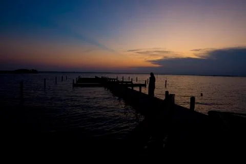 Sunset Silhouette on Dock Stock Photos
