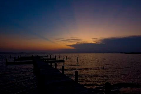 Sunset Silhouette on Dock Stock Photos