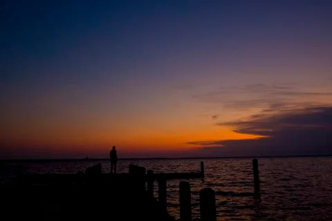 Sunset Silhouette on Dock Stock Photos