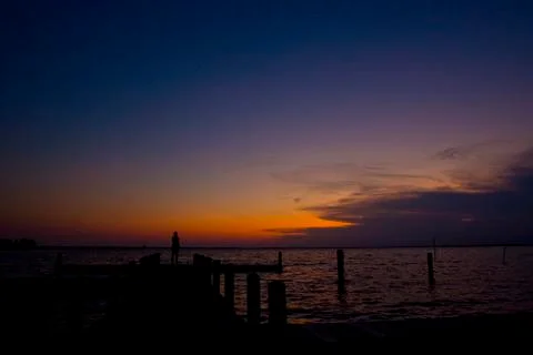 Sunset Silhouette on Dock Stock Photos