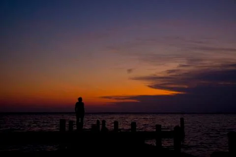 Sunset Silhouette on Dock Stock Photos