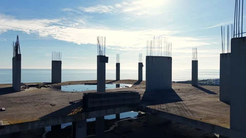 Sunset silhouette of rooftop columns above the sea, Bulgaria Stock Footage 339666416