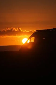 Sunset Silhouette of a Van Foto stock