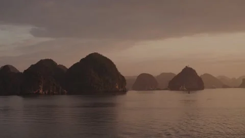 Sunset Silhouettes of Limestone Karsts in Ha Long Bay, Vietnam Stock Footage 329011022