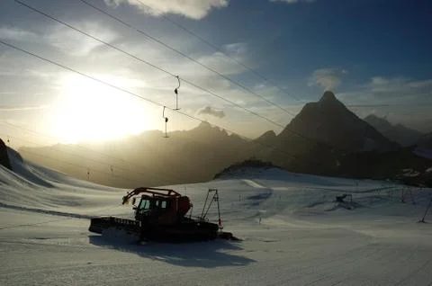 Sunset ski slope snowplow Stock Photos