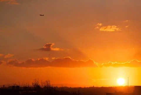 Sunset skies with sun rays Stock Photos