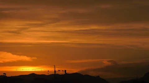 Sunset Skies Time Lapse With Contruction Site In Foreground Stock Footage 114971277