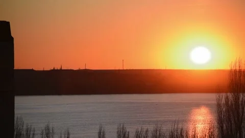 Sunset sky above river , sea-gulls flying in golden sky nature, romantic evening Stock Footage 170328161