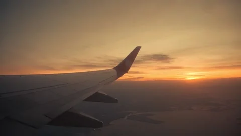 Sunset sky on airplane, plane window. Lion Air Stock Footage 137897314