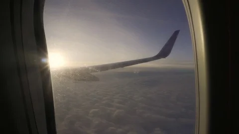 Sunset in the sky from the airplane window wing of the plane. Stock Footage 83521705
