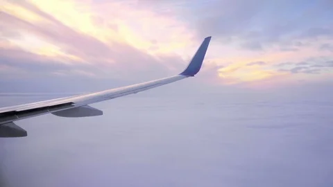 Sunset in the sky from the airplane window wing of the plane. Stock Footage 83521785