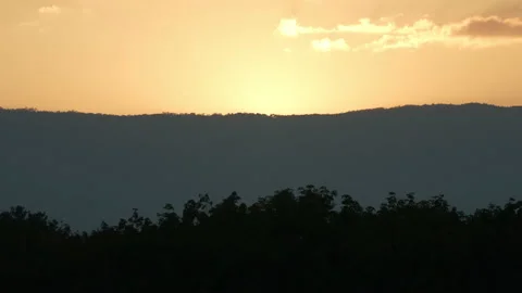 Sunset sky and clouds over hill or mountain background Stock Footage 218621438