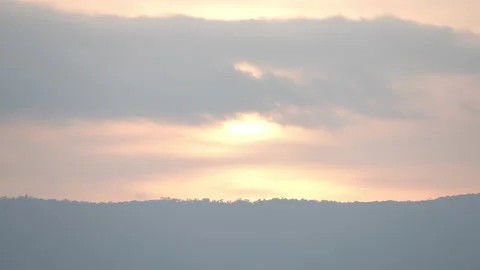 Sunset sky and clouds over hill or mountain background 動画素材 219057390
