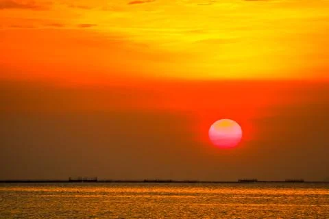 Sunset on sky back soft evening cloud over horizon sea 写真素材