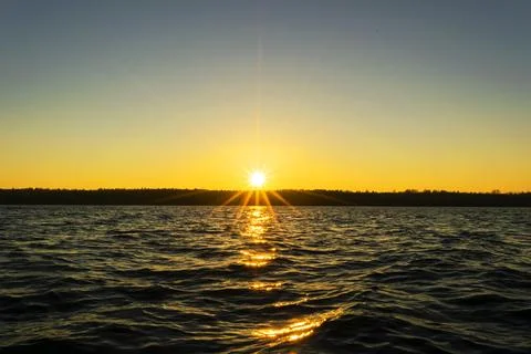 Sunset sky background. Dramatic gold sunset sky with evening sky clouds ove.. Stock Photos