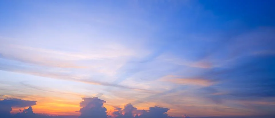Sunset sky background with nature gradient light and clouds on orange and b.. Stock Photos