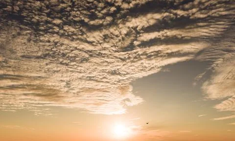 Sunset on sky background. Sunset rays in clouds. Sunset glowing dusk. Sunset Stock Photos