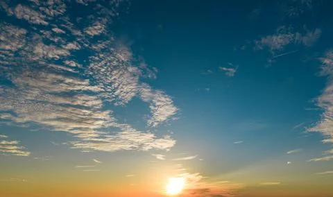 Sunset on sky background. Sunset sunlight in cloudscape. Sunset glowing summe Stock Photos