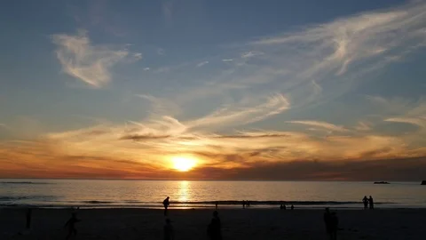 Sunset sky with beach people silhouettes 库存影片 79023751
