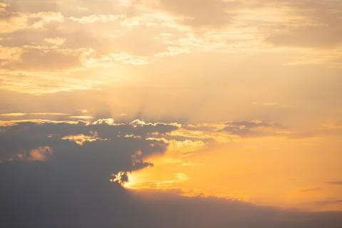 Sunset in the sky with beautiful yellow rays. Stock Photos