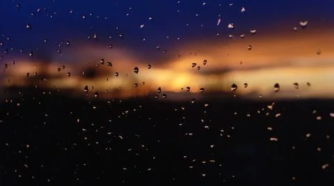 Sunset sky behind the window after rain Stock-Fotos