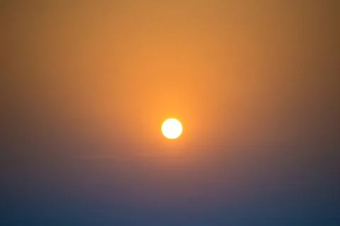Sunset in the sky with big sun Stock Photos