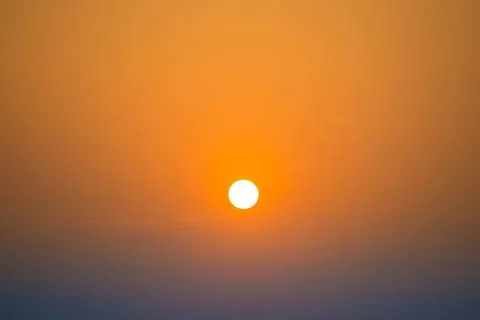 Sunset in the sky with big sun Stock Photos