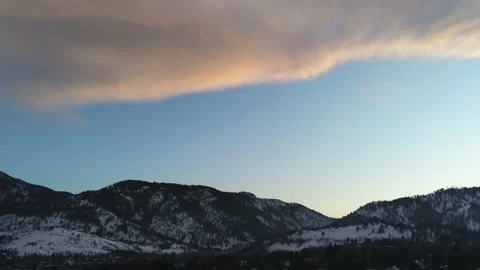 Sunset sky to brick building - Drone camera moves down &amp; up Stock Footage 137894748