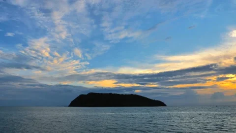 Sunset sky with clouds above tropical island Stock Footage 133134113