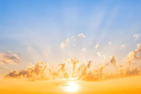 Sunset sky with clouds and bright orange light Stock Photos