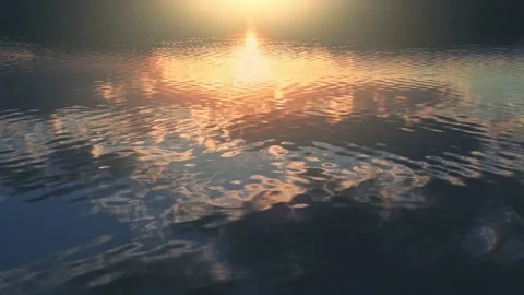 Sunset sky with clouds are reflected in the water surface. Stock Footage 180537815