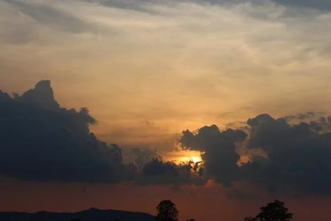 Sunset Sky Clouds in the evening with Red, Orange, Yellow and purple sunlight on Stock Photos