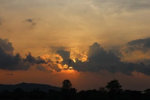 Sunset Sky Clouds in the evening with Red, Orange, Yellow and purple sunlight on Stock Photos