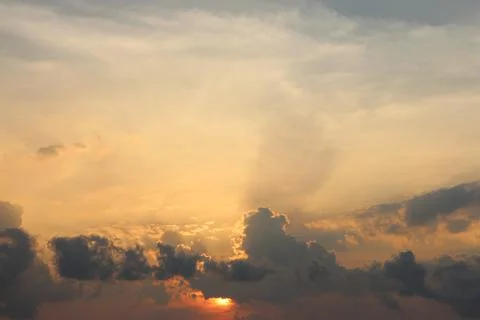 Sunset Sky Clouds in the evening with Red, Orange, Yellow and purple sunlight on Stock Photos