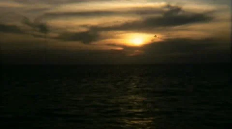 Sunset Sky Clouds Ocean 1 - Vintage Super8 Film Video stock 11496843