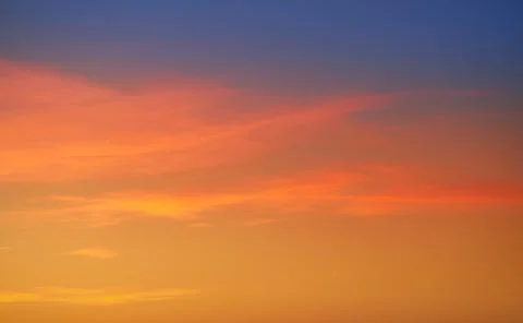 Sunset sky clouds orange and blue Stock Photos